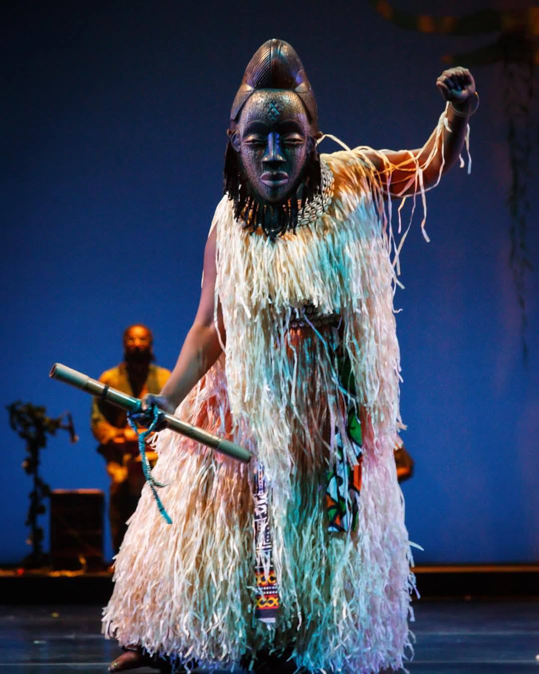 Masked Juju dancer in raffia costume headlining BAM DanceAfrica 2024