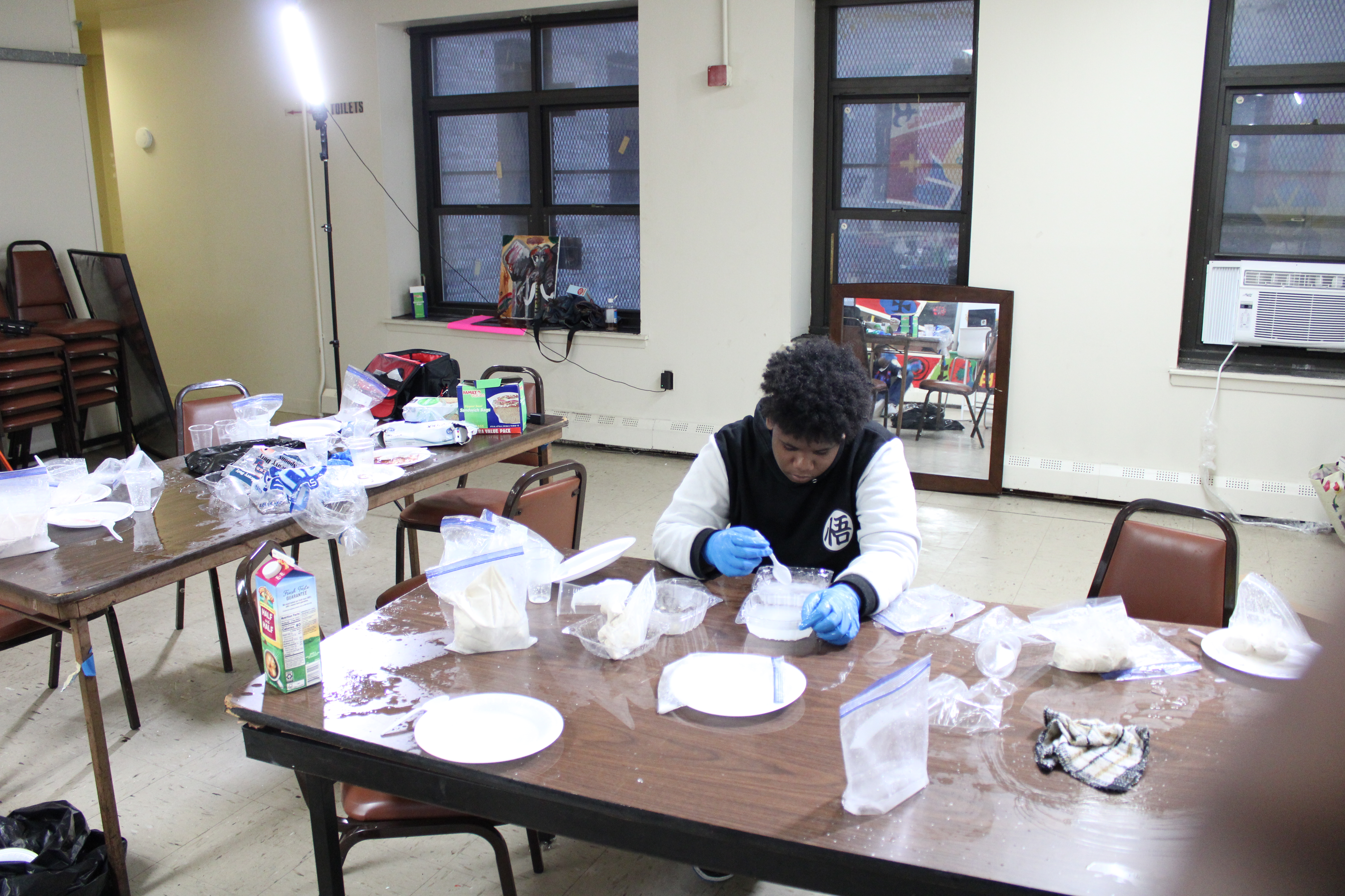 Participant creating handmade crafts during community arts program workshop